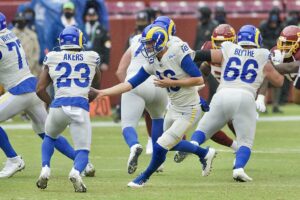 rams running back cam akers takes a handoff from jared goff