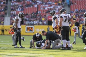 J.K. Dobbins of the Ravens on the field after suffering an injury